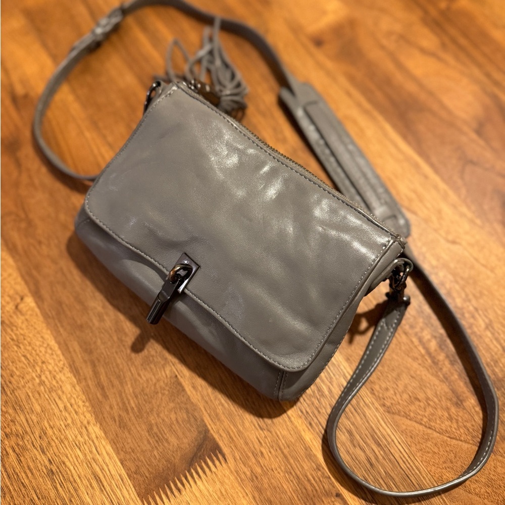 Sleek Elizabeth and James Gray Crossbody Bag with Adjustable Strap